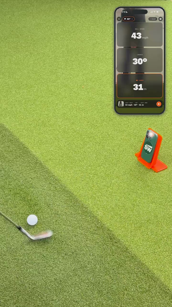 Load video: Strike Wedge Launch capturing a wedge shot: the phone on the turf reads ball speed, launch angle and carry
