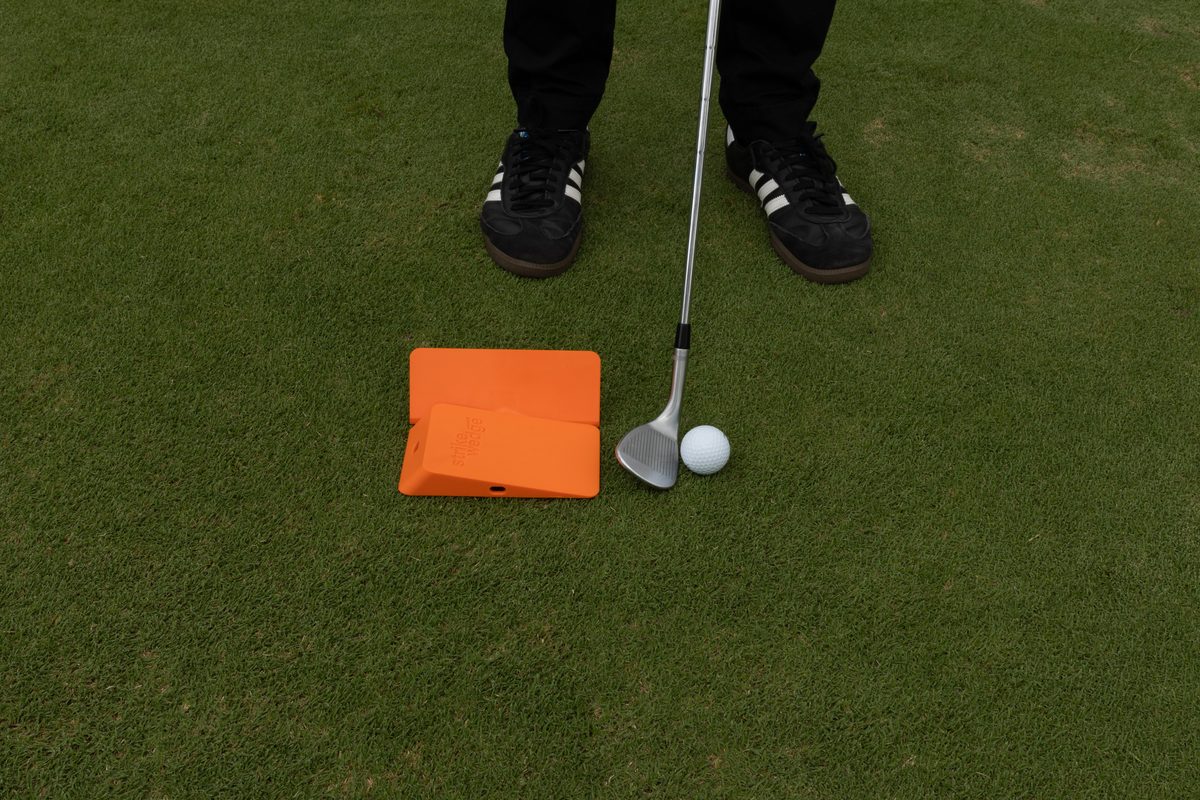 Strike Wedge set up behind the ball at address